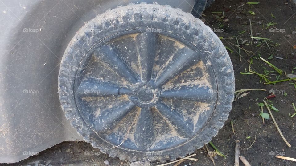 Dusty wheel on a refuse bin