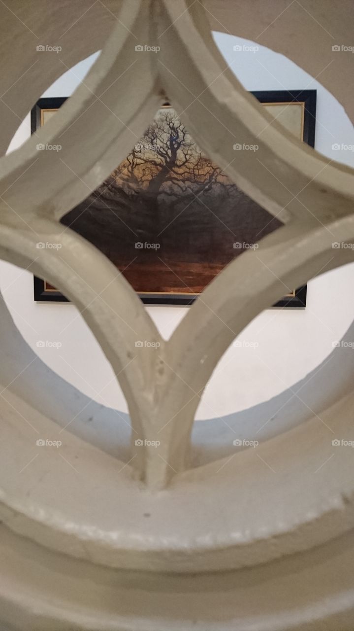 between the stone stair railings at Nottingham castle and art gallery over looking a painting