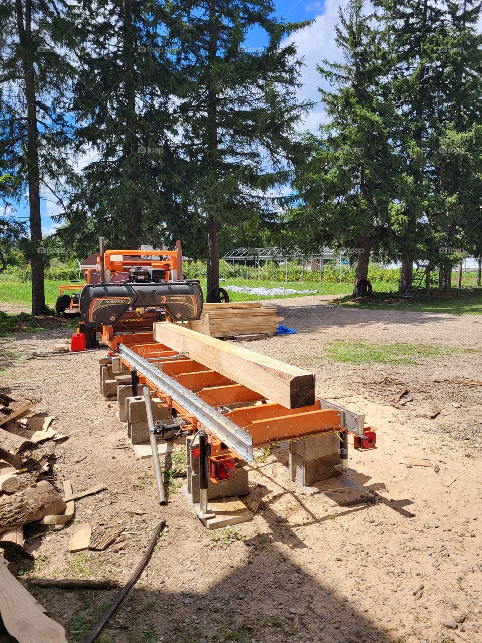 Sawmill with milked cut timber