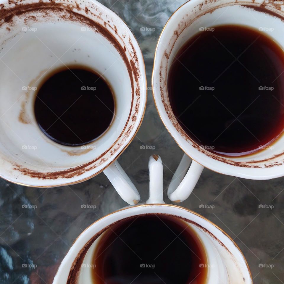 coffee in a partially drunk cup with traces of coffee on the edge of the cup
