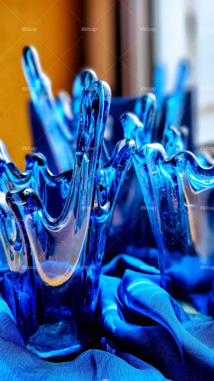 Beautiful blue glass vases, so you can place the most beautiful flower arrangements and make your home and your day more beautiful.