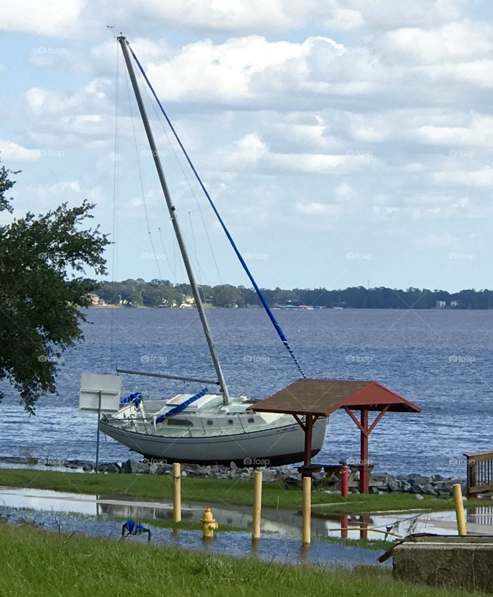 Washed ashore sailboat after a hurricane