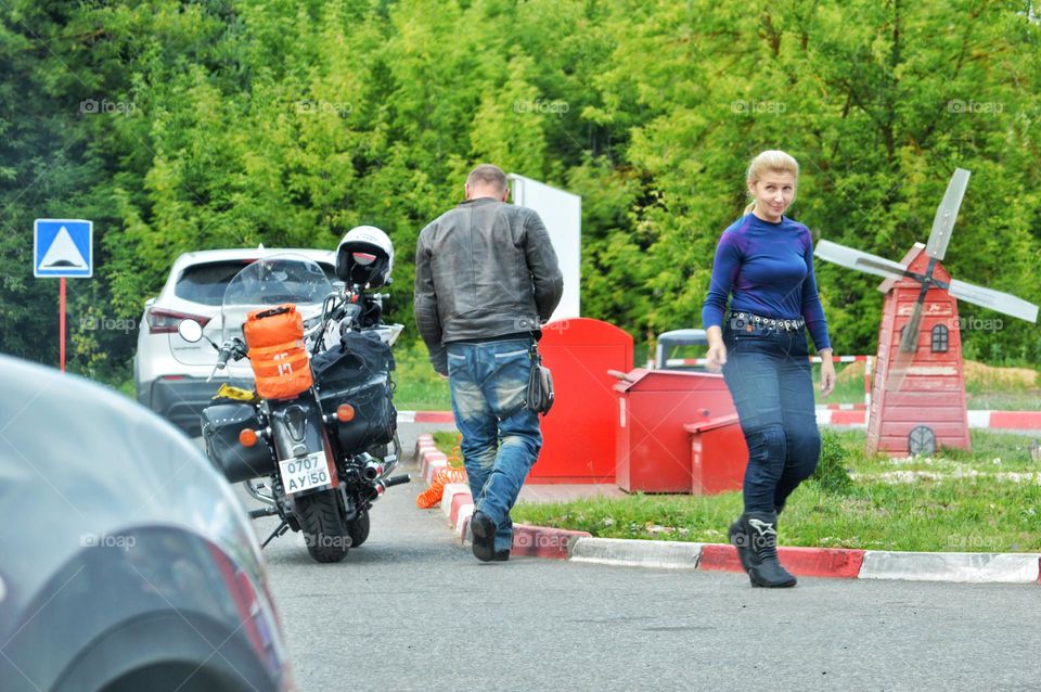 bikers at the pit stop buy gasoline for the further journey