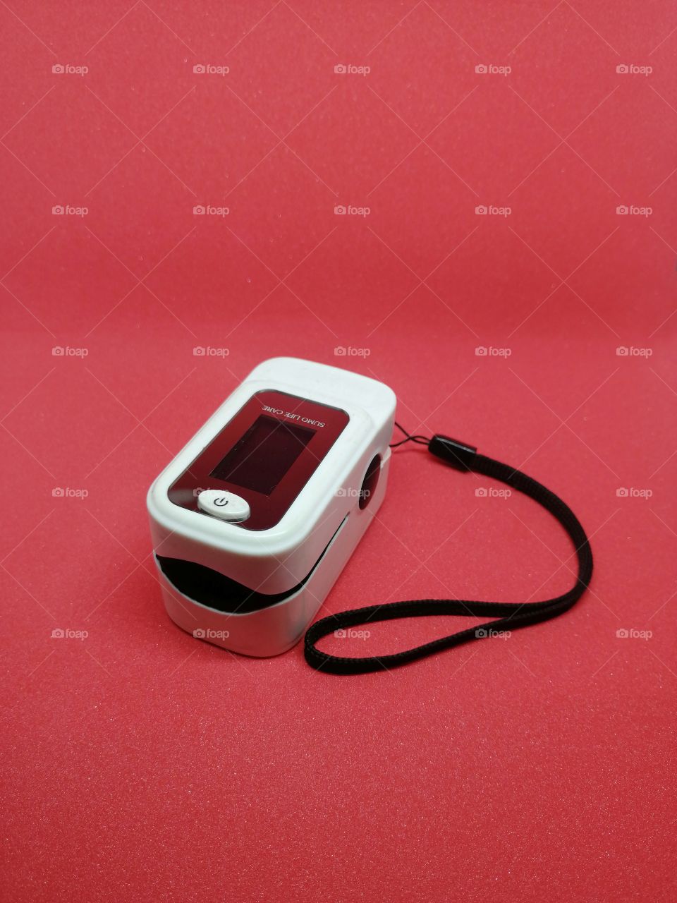 Finger Pulse Oximeter on red background.
A pulse oximeter is a medical device that indirectly monitors the oxygen saturation of a patient's blood.