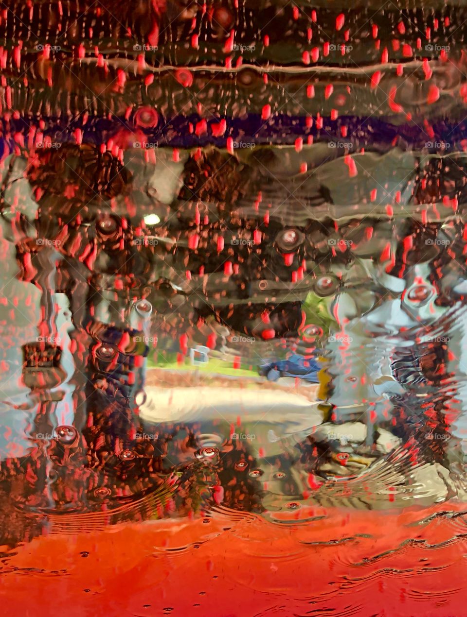 Red lighting inside car wash 