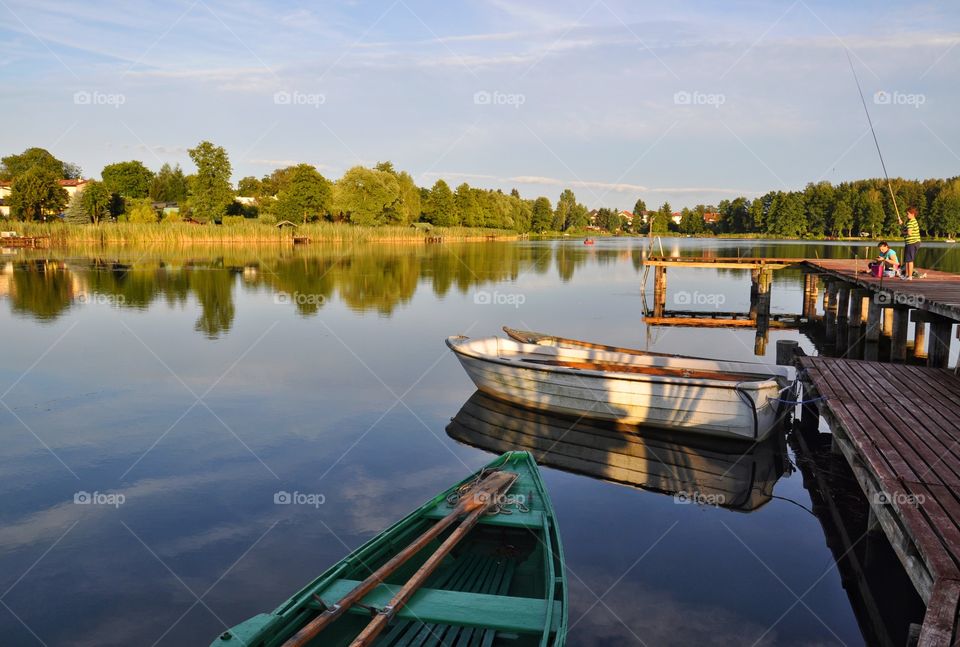 summertime fishing at the lake in olsztyn, poland