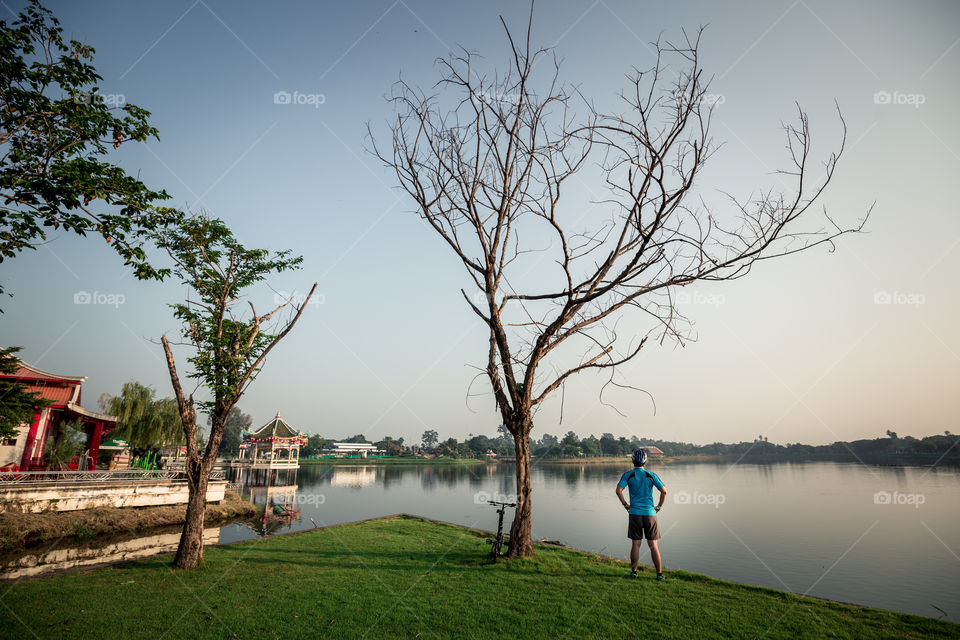 Man looking to the pond in the park