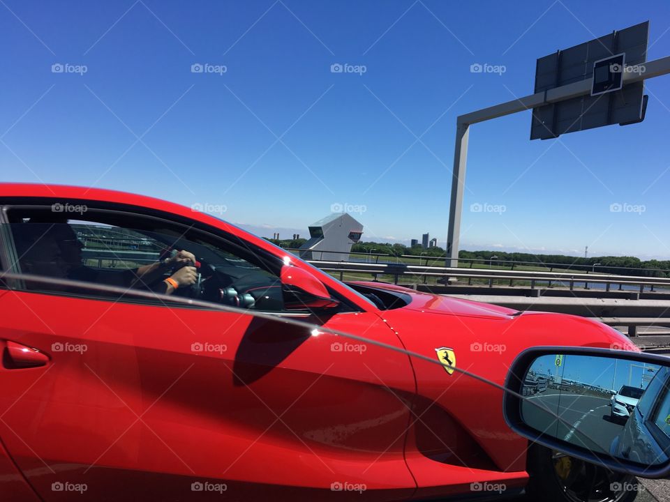 ferrari red on the bridge in the netherlands