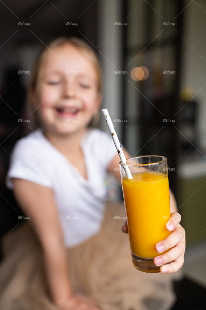 Girl drinking fresh orange juice