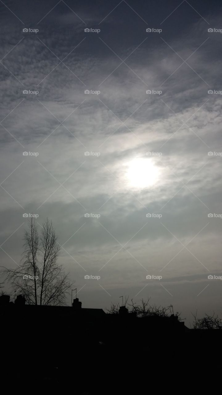 An eerie picture of the summer eclipse with clouds covering the true stunning image.