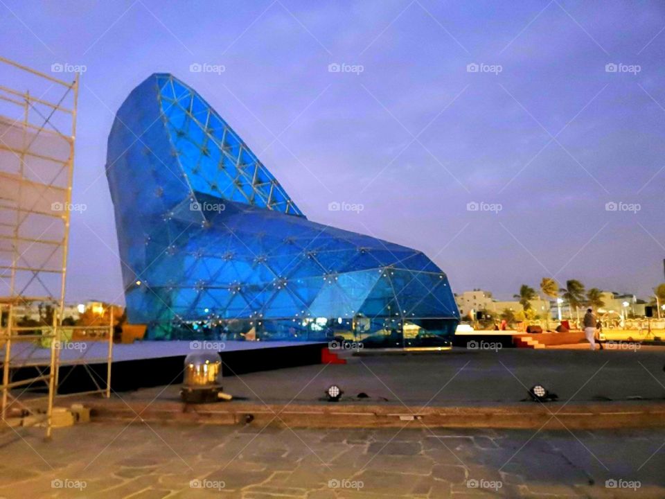 a shiny glass shoe that attracts more tourist