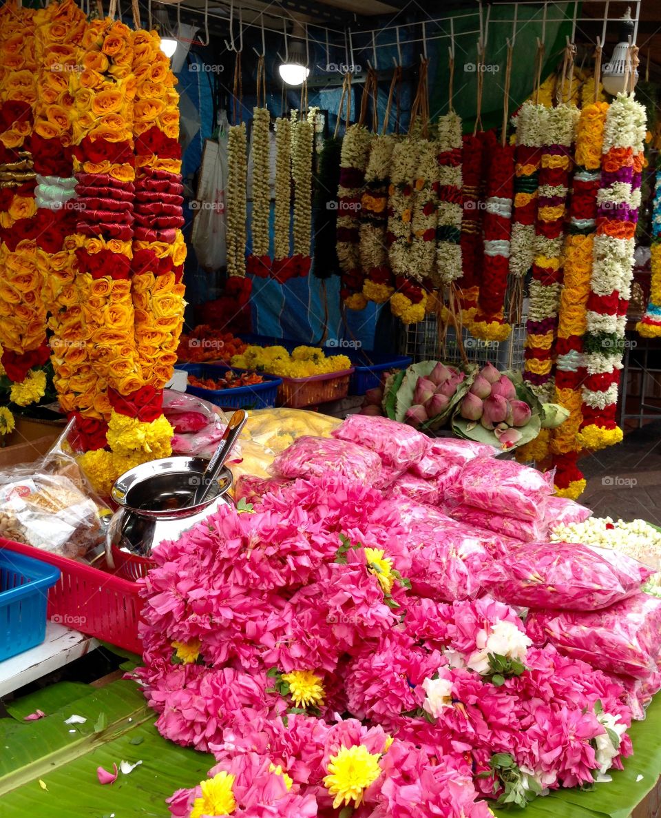 A shop in little India, Singapore, selling fresh garlands of real flowers; roses, jasmine, lotus etc.