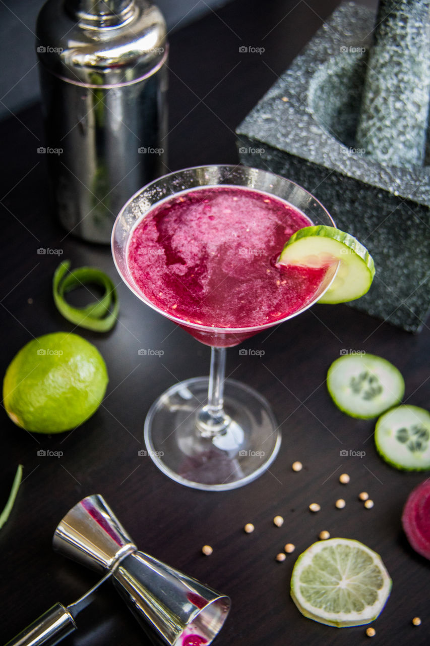 Homemade cucumber and lime vodka with a coriander and beetroot syrup 
