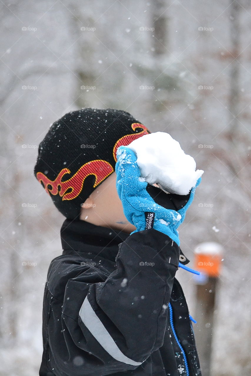 Boy throwing a snowball