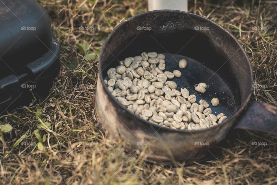 Fresh burned coffee beans. Iternational BBQ. Friend from Eritrea prepare for us coffee with a traditional coffee drinking culture.