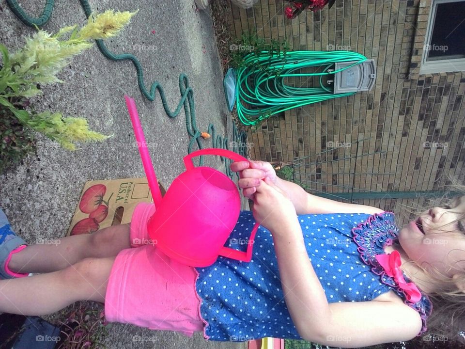 Child Watering flowers