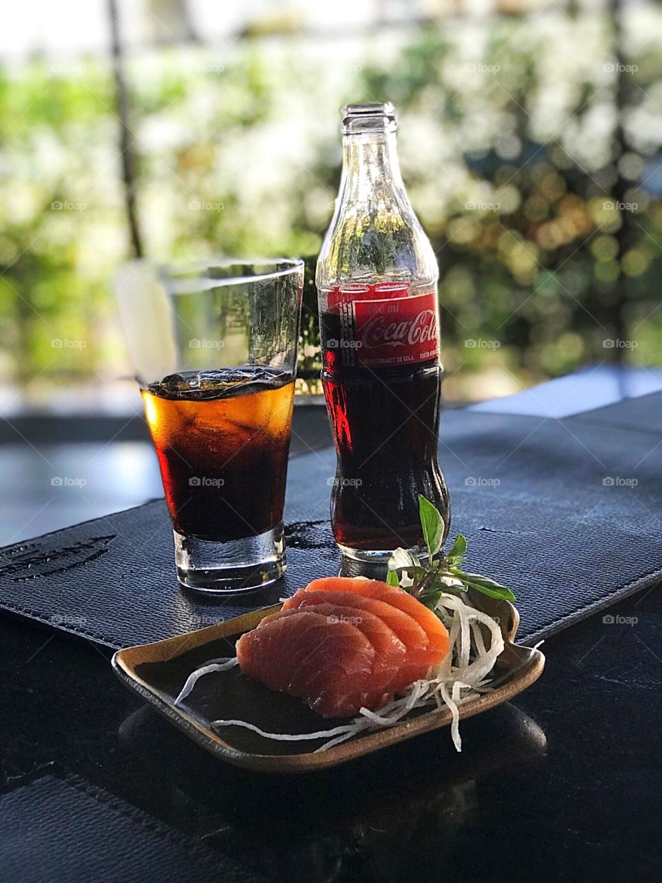 Coca Cola ice-cold with salmon sushi