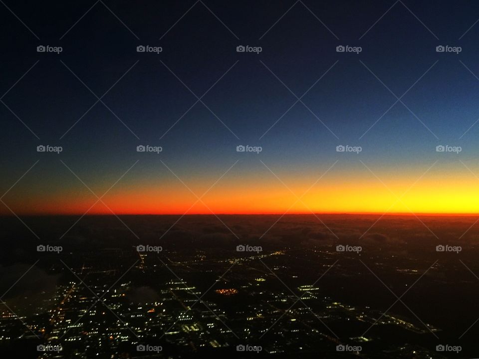 Sunrise in the city of Sydney from the airplane 