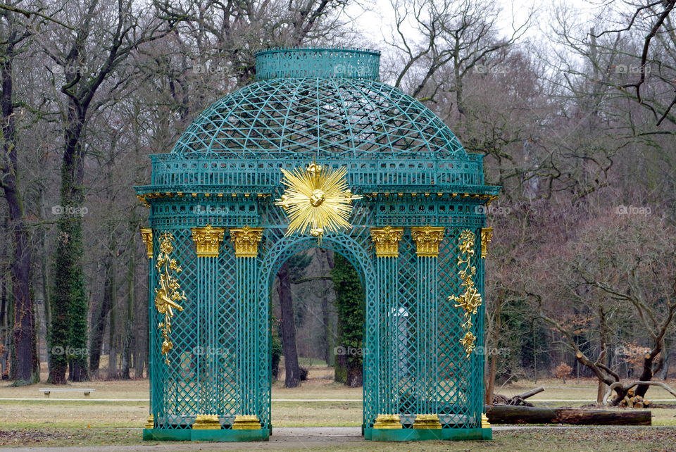 Gazebo against trees in park.