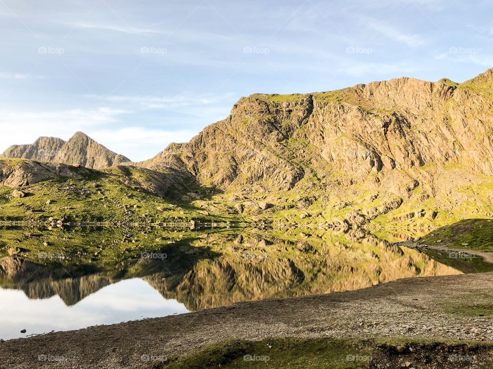 Beautiful reflection on a perfectly still lake in Snowdonia