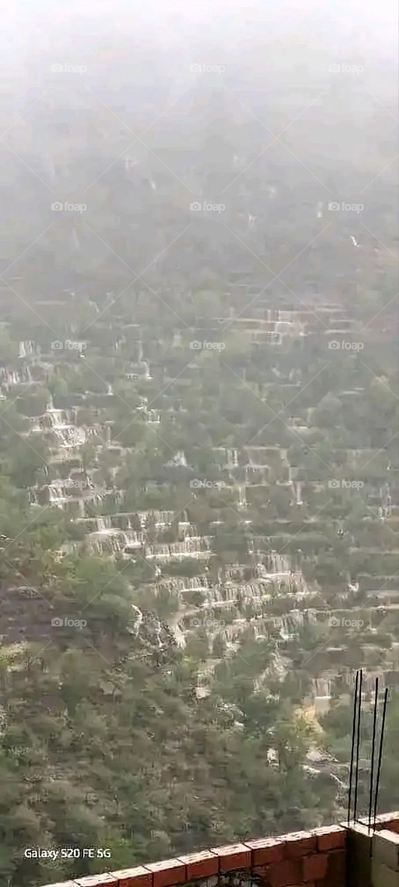 Glory be to God, the magnificent and picturesque view and the natural green trees are a view that is nothing more wonderful than it