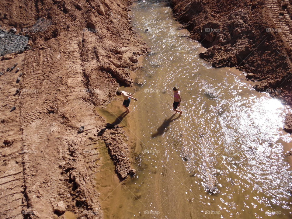 Local kids playing in the stream