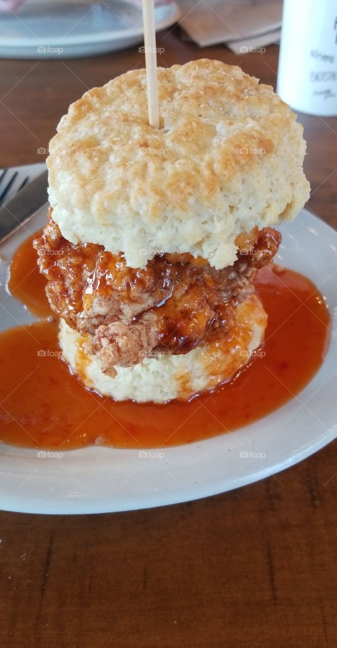 Fried chicken biscuit with fried goat cheese and pepper jelly