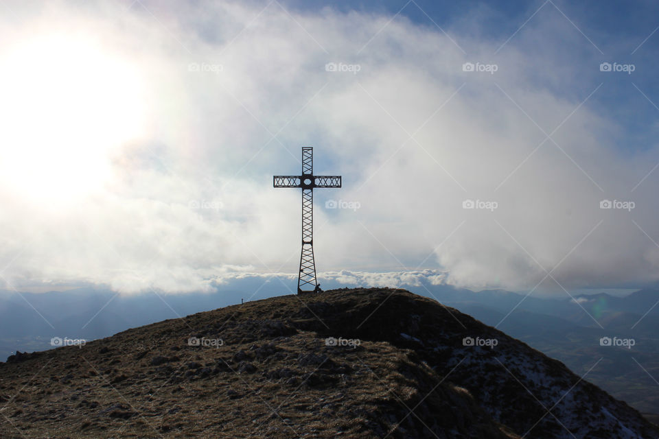 christian cross on the top of a mountain