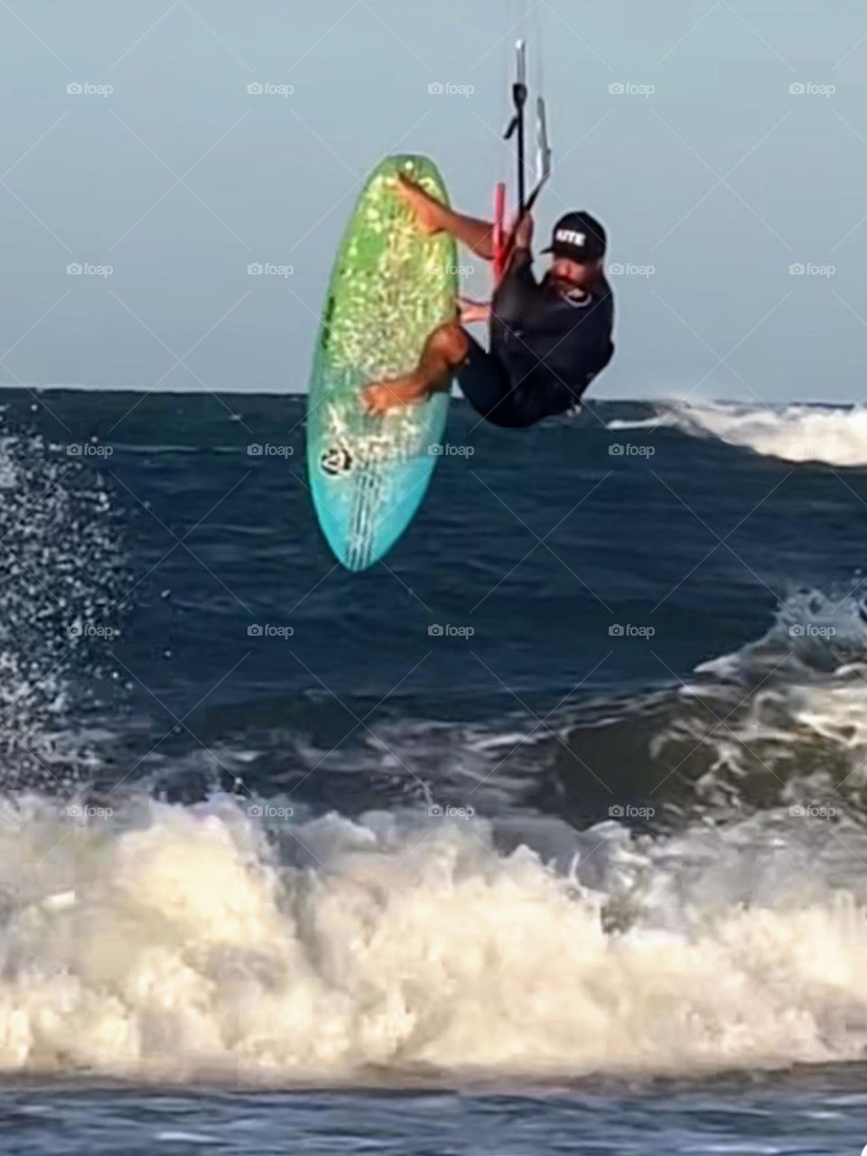 Man practicing kitesurfing