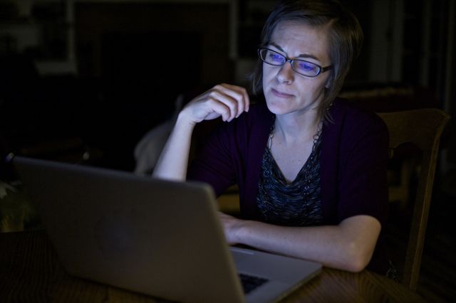 Woman angry at laptop computer. Technology getting a woman down