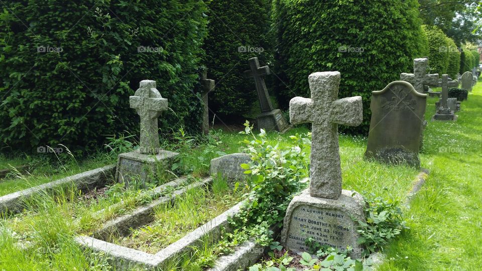 100 + years old graves
Some people think graveyard and cemetery mean the same, but, if we want to be a little nitpicky, we should say that graveyard is a type of cemetery, but a cemetery is usually not a graveyard. To understand the difference, we need a little bit of history.
From about the 7th century, the process of burial was firmly in the hands of the Church (meaning the organization), and burying the dead was only allowed on the lands near a church (now referring to the building), the so-called churchyard. The part of the churchyard used for burial is called graveyard, an example of which you can see in the picture.
As the population of Europe started to grow, the capacity of graveyards was no longer sufficient (the population of modern Europe is almost 40 times higher than it was in the 7th century). By the end of the 18th century, the unsustainability of church burials became apparent, and completely new places, independent of graveyards, were devised—and these were called cemeteries.
The etymology of the two words is also quite intriguing. The origin of "graveyard" is rather obvious; it is a yard filled with graves. However, you might be surprised to hear that "grave" comes from Proto-Germanic *graban, meaning "to dig", and is unrelated to "gravel".
Of course, the word "cemetery" did not appear out of the blue when graveyards started to burst at the seams. It comes from Old French cimetiere, which meant, well, graveyard. Nevertheless, the French word originally comes from Greek koimeterion, meaning "a sleeping place". Isn't that poetic?