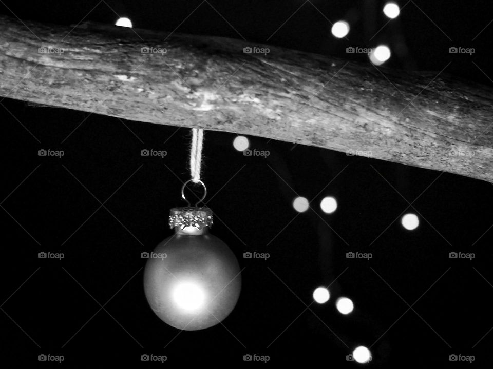Black and White image of a Christmas balls and bokeh lights