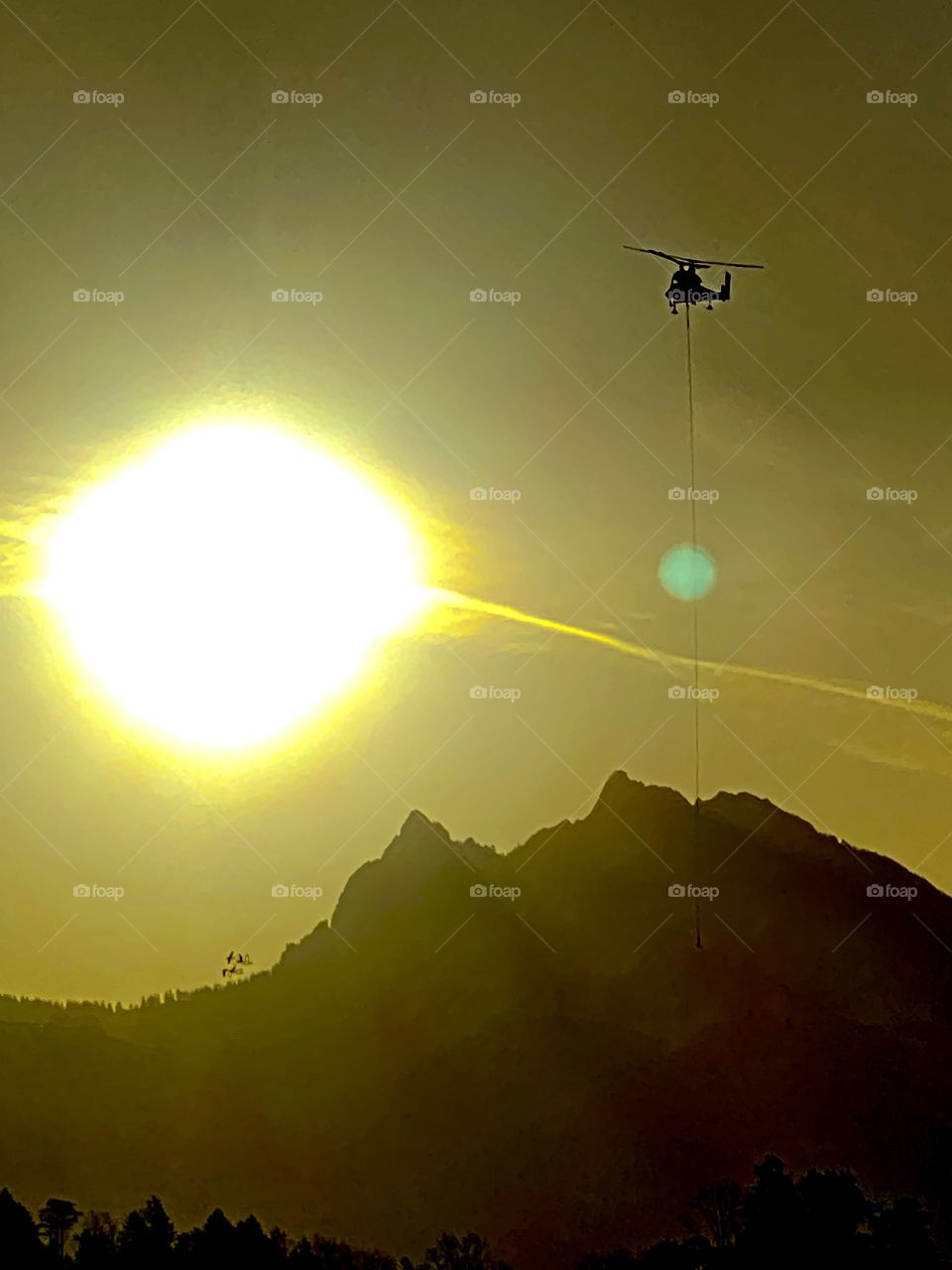 flying helicopter at sunset, Swiss Alps, mountains, romance, big round sun, yellow sun,