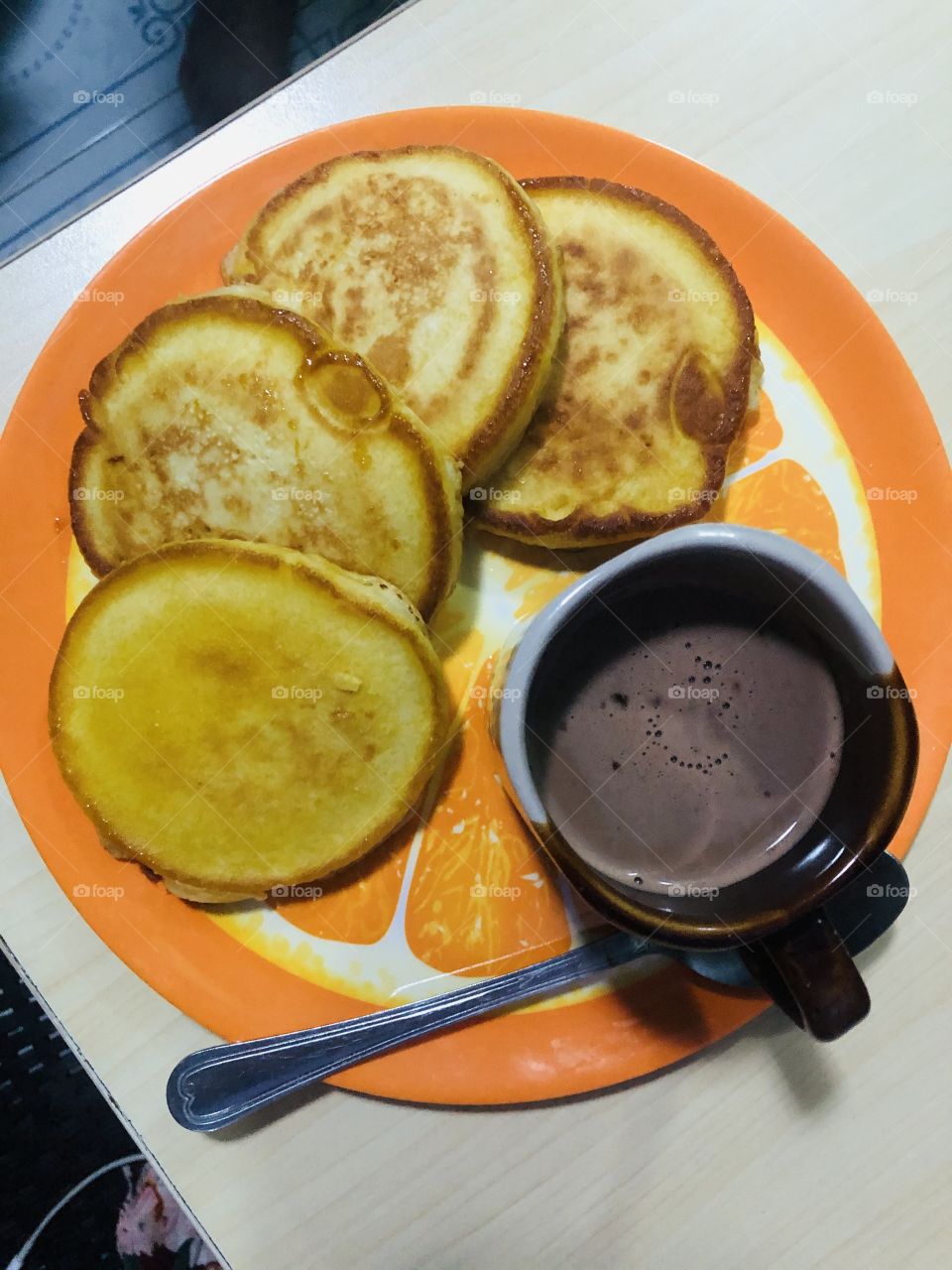 Pancake and hot chocolate.
