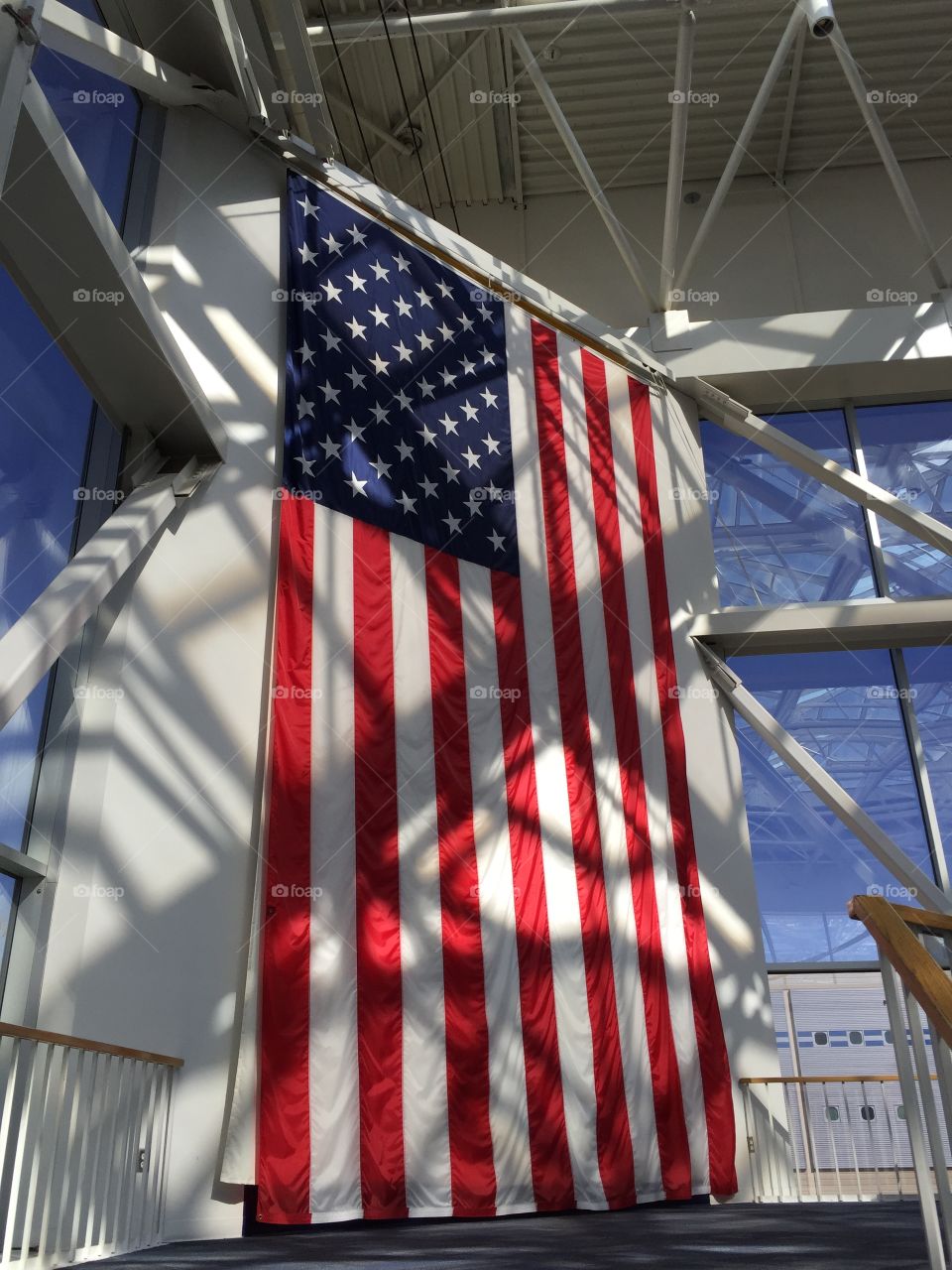 United states of America flag in front of a window