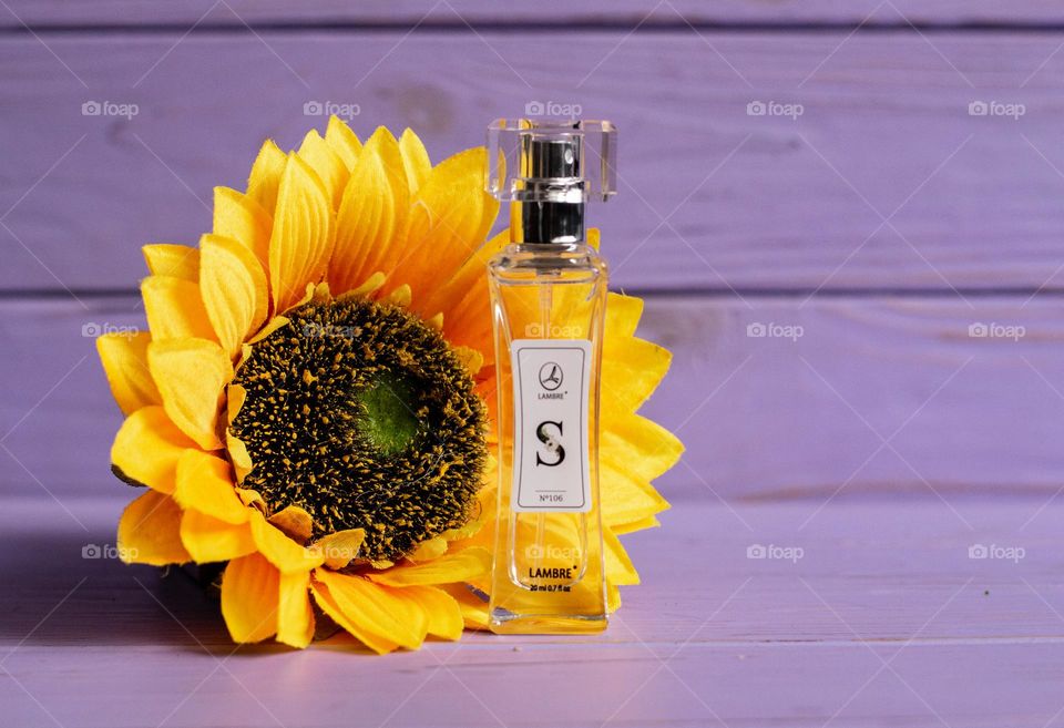 Aesthetic photo of parfum with sunflower 