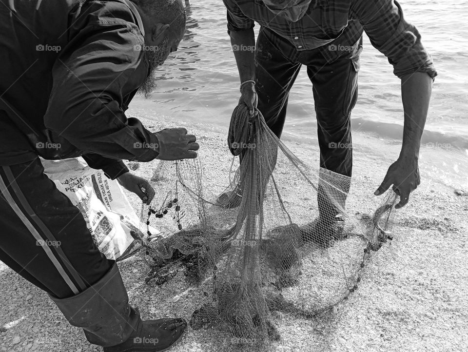 Checking the fishing net.