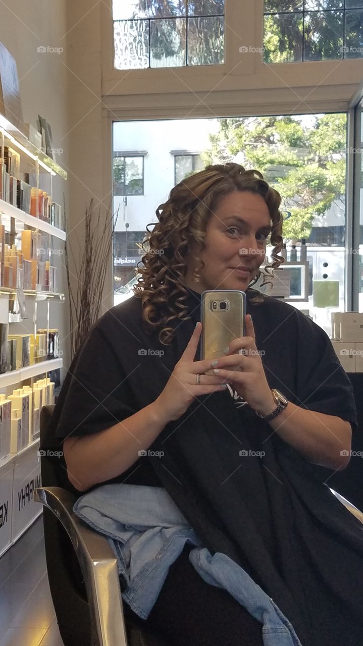 getting hair curled at salon