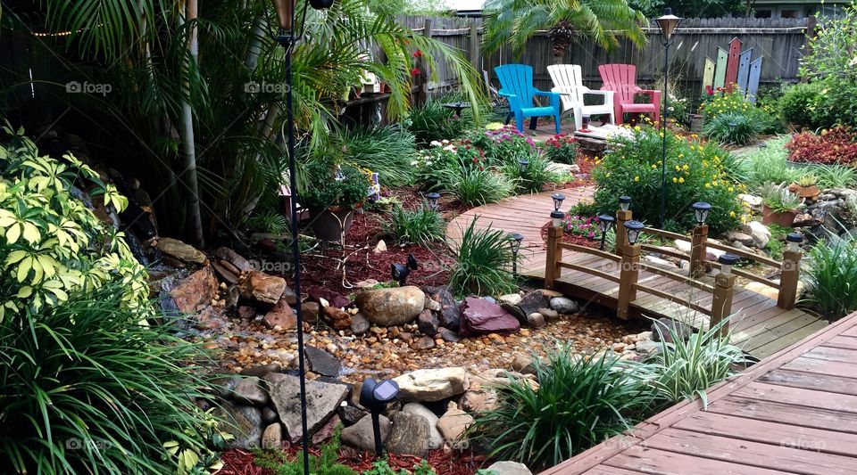 Garden with bridge and river. 