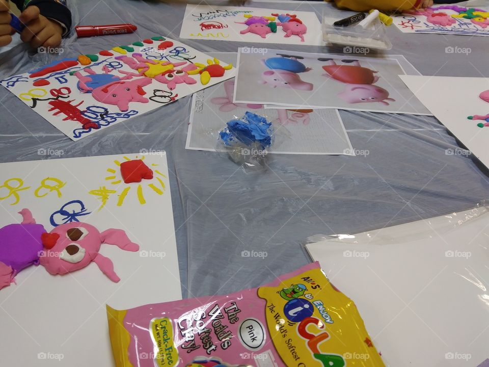 Teaching a bunch of adorable kids to use clay to make Peppa Pig come to life.