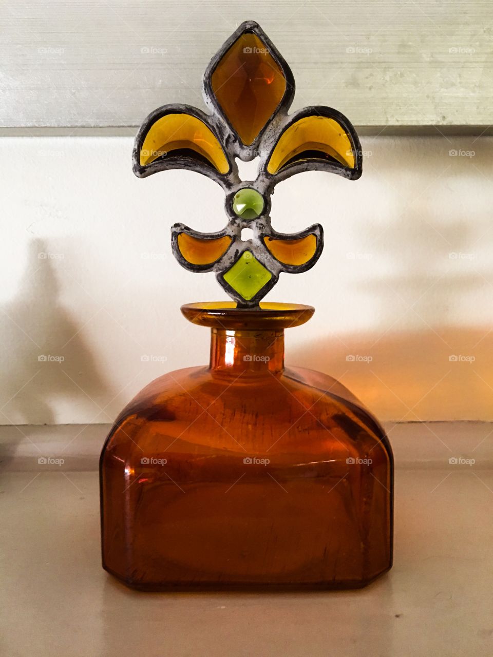 Art Deco glass bottle with leaded stained glass finial