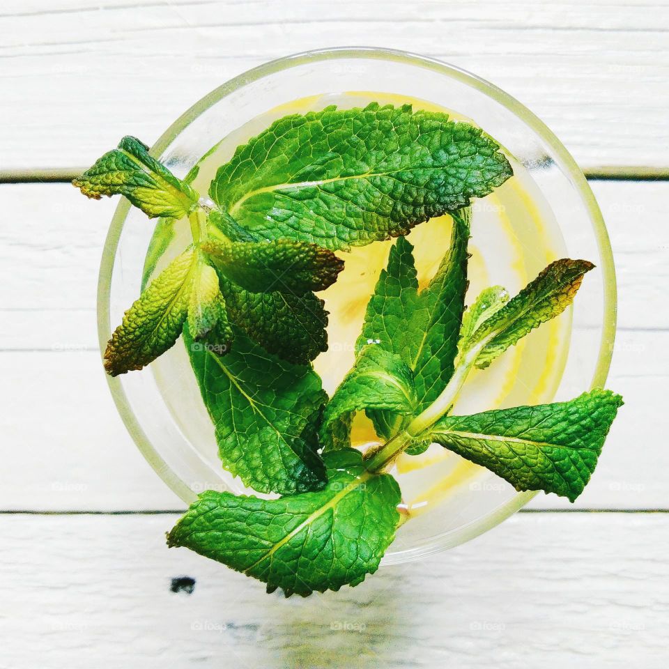 Lemonade with lemon and mint leaves