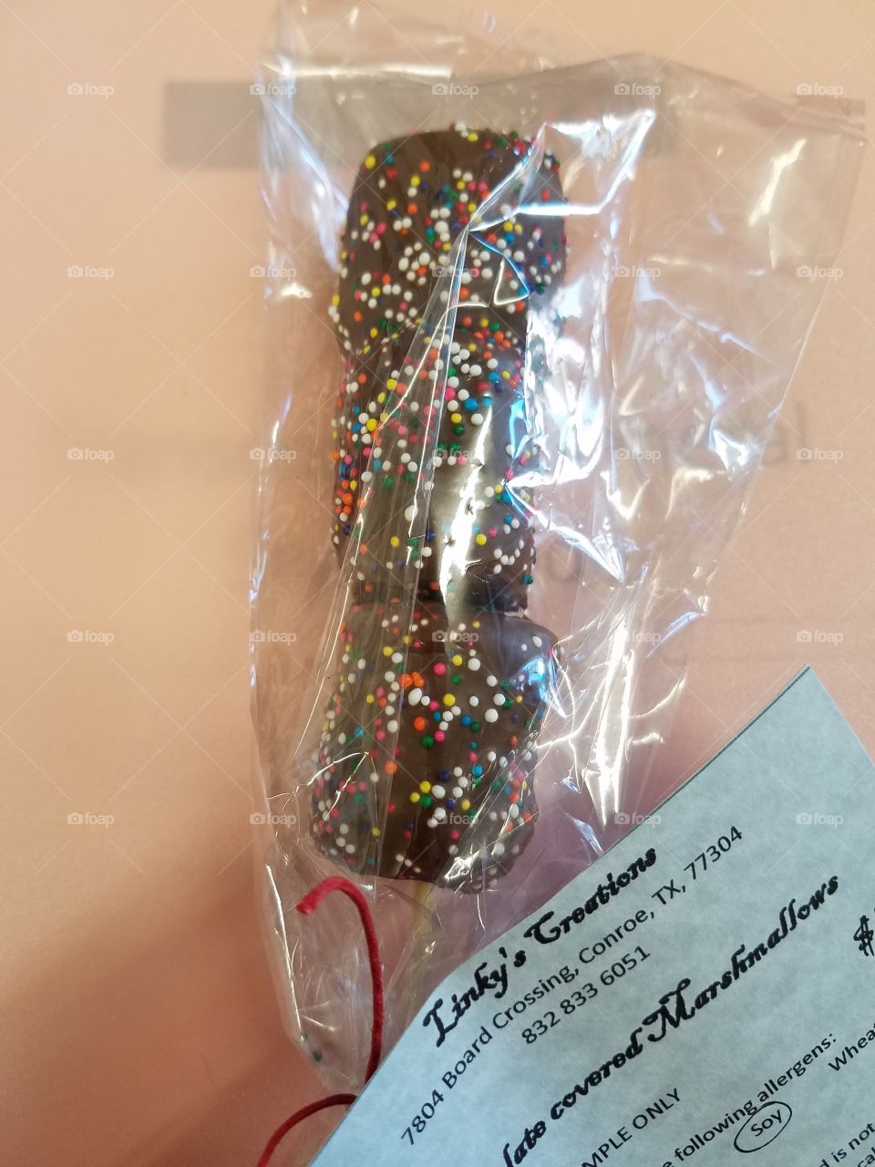Chocolate covered marshmallows with sprinkles