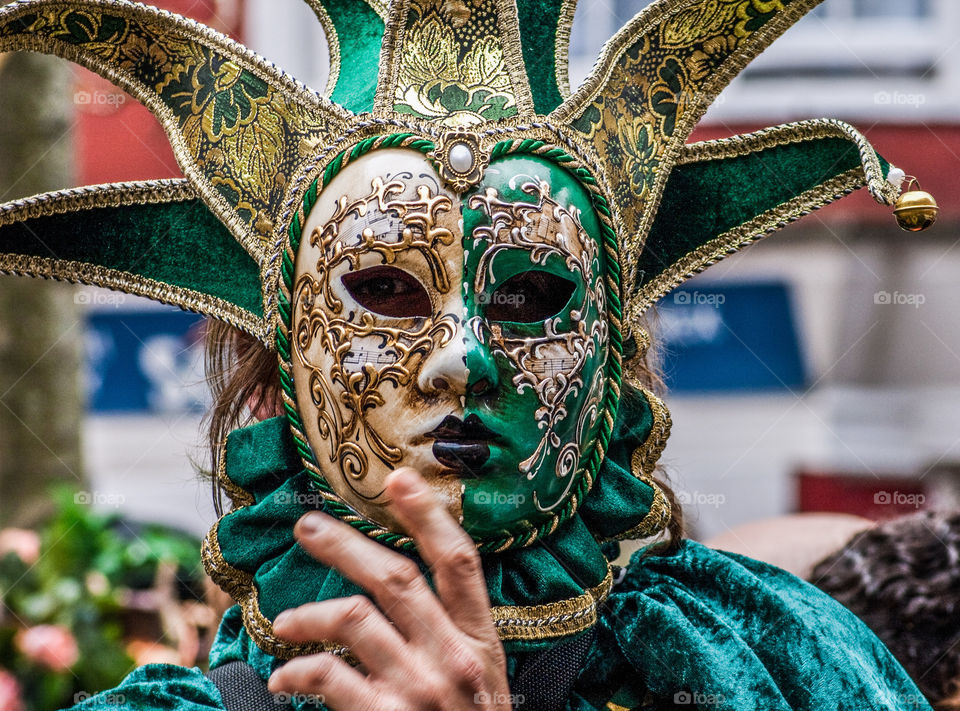 A reveller hides behind an elaborate, green mask at Hastings Traditional Jack in the Green, U.K. 2008