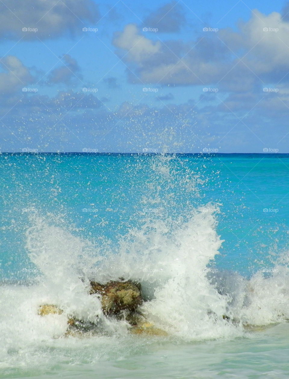 Waves splashing against rock