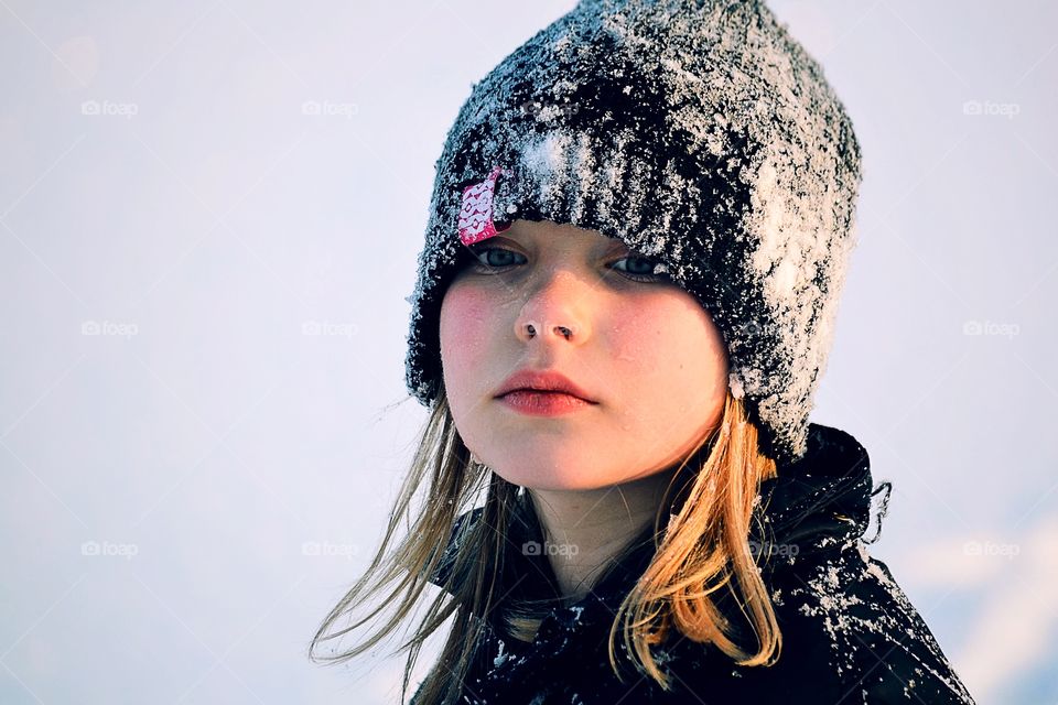 Girl in snowy hat