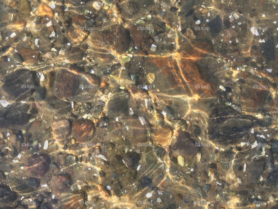 Ocean floor through crystal clear water