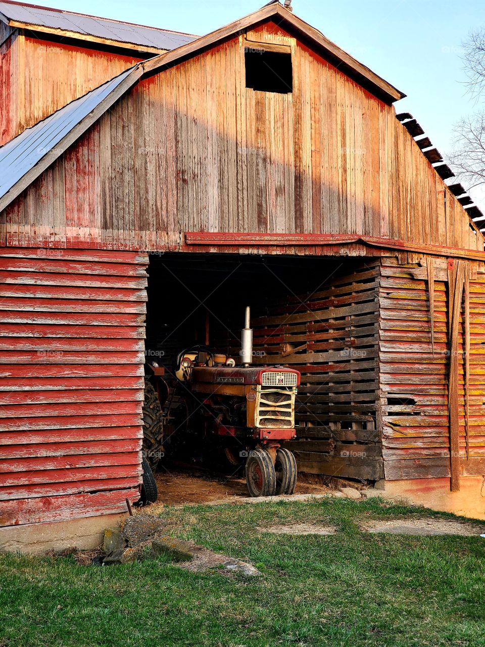 Old tractor and barn