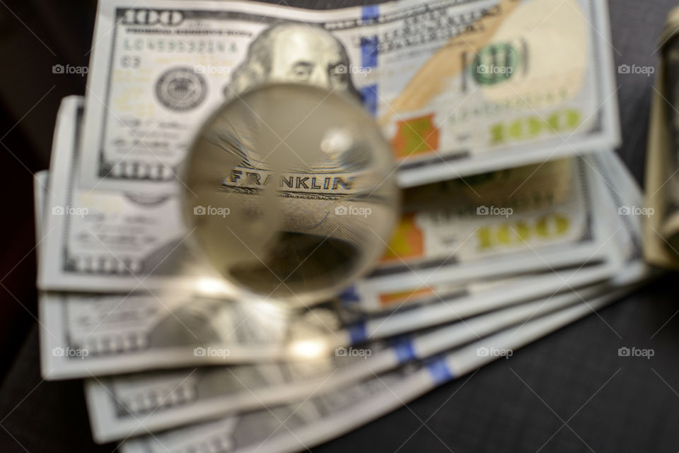 transparent globe on dollars