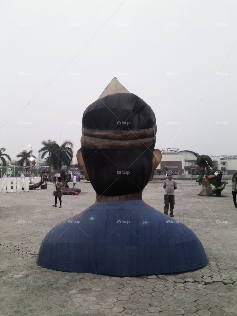 Giant Form of a Man wearing traditional hat of Palembangnese called Tanjak in Jakabaring Palembang